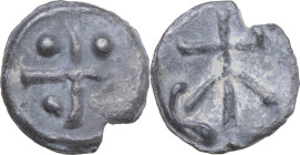 Leads from Ancient and Medieval World. PB Tessera. D/ Cross with pellets in the angles. R/ Uncertain symbol. PB. 1.85 g. 14.5 mm.