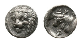 CARIA. Uncertain. Circa 400-350 BC. Hemiobol.
Obv: Head and neck of a lion to left, three-quarter facing.
Rev: MYϘ-[Η]-Φ Head and neck of a bull to ...