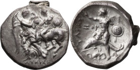 Calabria, Tarentum. Stater; Calabria, Tarentum; c. 302-280 BC, Stater, 7.84g. Vlasto-679, SNG ANS-1057, HN Italy-963. Obv: Nike standing r, restrainin...