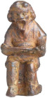 Roman Bronze Comedic Actor; Roman Bronze Comedic Actor, ca. 1st Century AD. Seated on an incised integral stand, wearing a long sleeve tunic and laced...