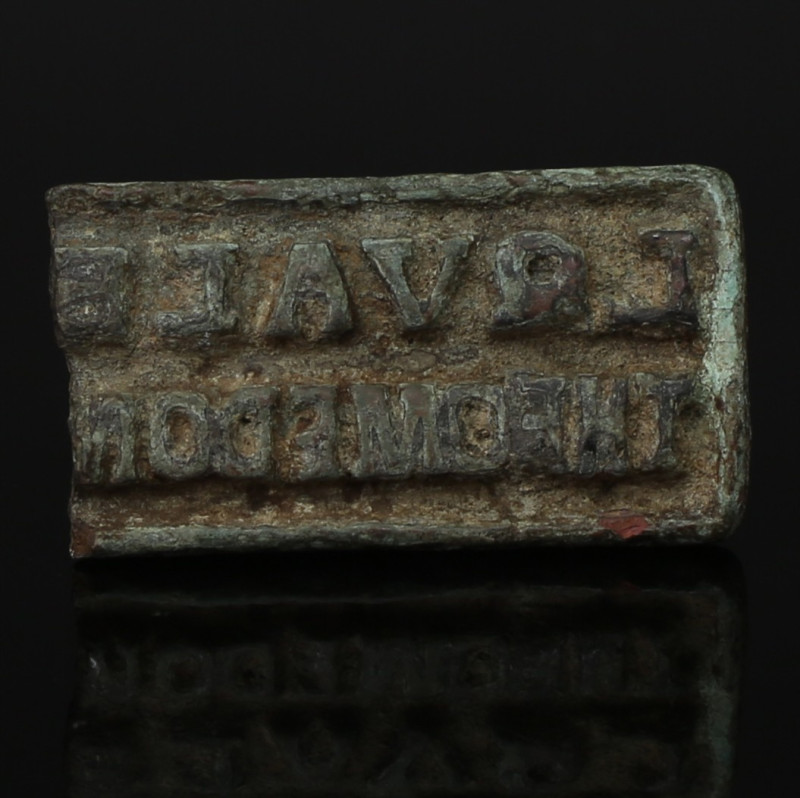 ITEM: Bread stamp with inscription 'L QVAL... / THEOMEDO... '
MATERIAL: Bronze...