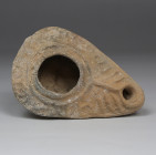 Byzantine oil lamp with inscription 'The light of Christ shines for all'