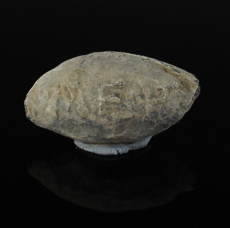 ITEM: Sling bullet with inscription 'NA / MER'
MATERIAL: Lead
CULTURE: Greek
...