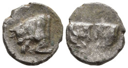 CARIA. Uncertain. (5th century BC)
AR Hemiobol (7,5mm 0,24g)
Obv: Confronted foreparts of two bulls.
Rev: Forepart of a bull to left; between his h...