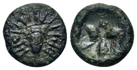 Italy, Southern Lucania, Metapontion, c. 300-250 BC. Æ (12mm, 2,2g). Facing head of Helios. R/ Three barley grains conjoined at base; race torch in on...