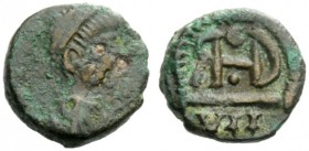THE OSTROGOTHS 
 Theoderic, 493-526 
 Pseudo-Imperial Coinage. In the name of Justin I, 518-526 . Nummus, Sirmium (?) 518-526, Æ 1.02 g. [DN IVSTI –...