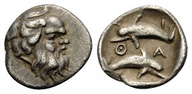 ISLANDS OFF THRACE, Thasos. Circa 412-404 BC. Hemiobol (Silver, 9 mm, 0.42 g, 9 h). Head of bald and bearded satyr to right. Rev. Θ-Α-Σ-I Two dolphins...