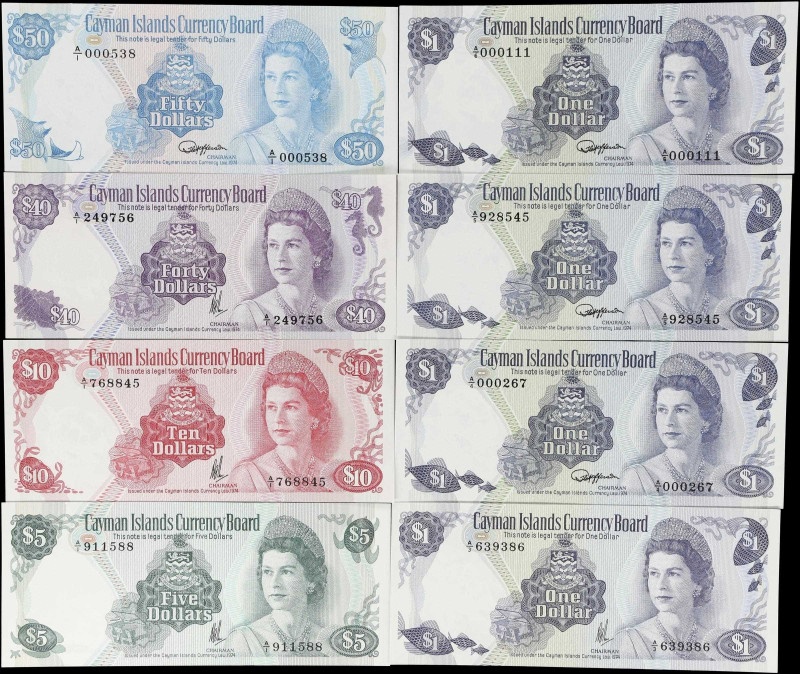 CAYMAN ISLANDS. Lot of (8). Cayman Islands Currency Board. 1, 5, 10, 40, & 50 Do...