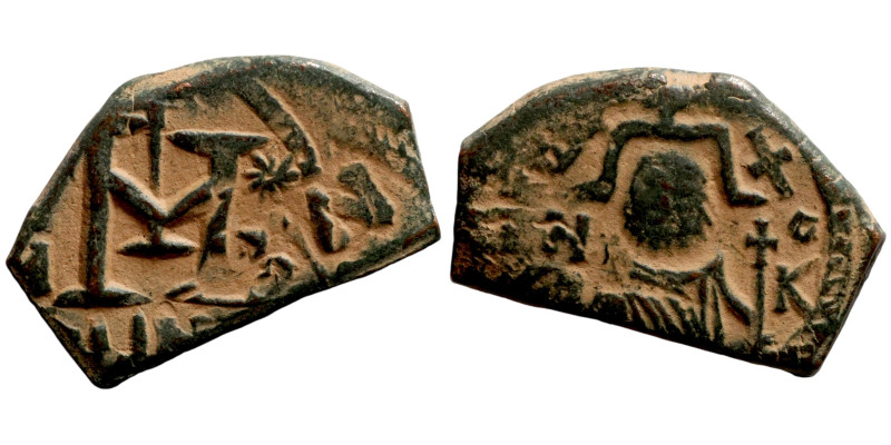 Arabic imitation of Heraclius Follis. Obverse: Bust of emperor. Reverse: M

16...