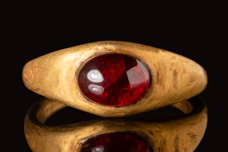 MEROVINGIAN GOLD RING WITH GARNET CABOCHON

 Ca. AD 400 - 600 A Merovingian go...