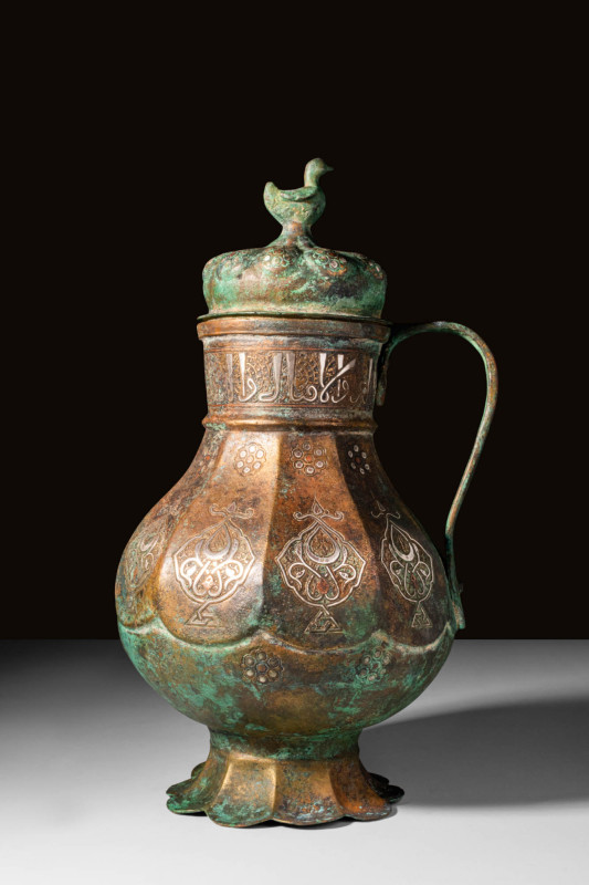 SELJUK SILVER-INLAID BRONZE EWER

Ca. AD 1000 - 1200 A Seljuk ewer of baluster...