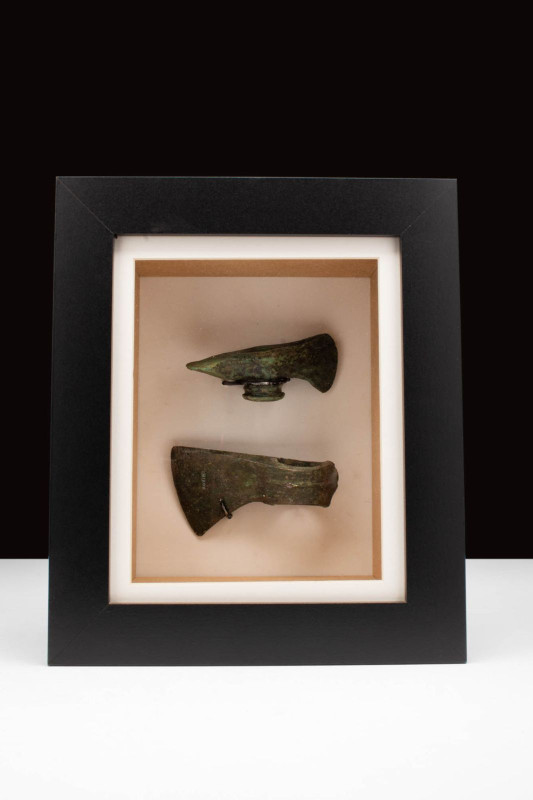 ANCIENT BRONZE AGE AXES

 Ca. 1200 - 900 BC A a pair of cast Bronze Age axe he...