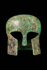 SUPERB CORINTHIAN BRONZE HELMET

 Ca. 500 - 400 BC A rare Corinthian helmet, hammered from a single heavy bronze sheet, with a long, tapered cheek-p...