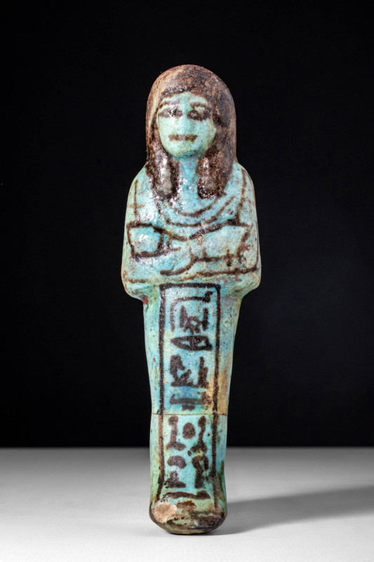 EGYPTIAN FAIENCE USHABTI WITH HIEROGLYPHIC INSCRIPTION

New Kingdom, XXth Dyna...