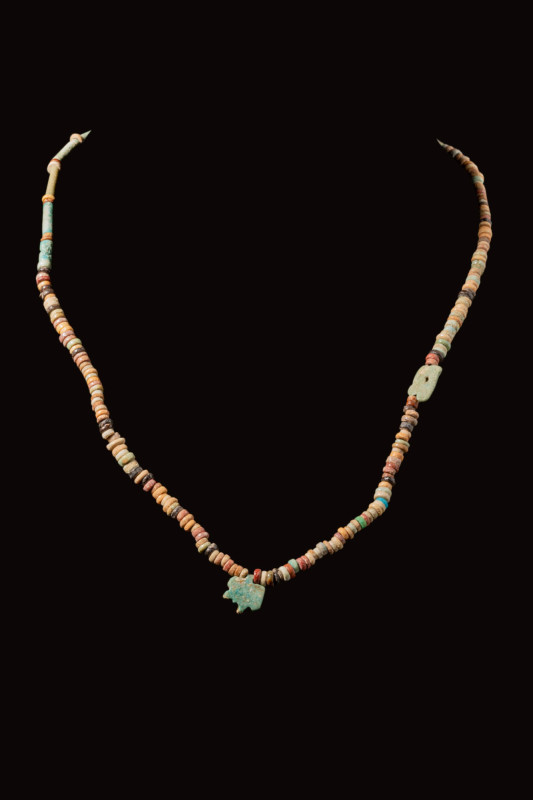 EGYPTIAN FAIENCE SEED NECKLACE WITH WAJET PENDANT

 Late Period, Ca. 664 - 332...