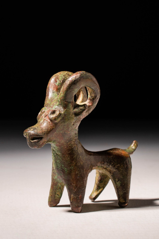 GREEK BRONZE FIGURINE OF IBEX

 Ca. 900 - 700 BC A Greek geometric bronze figu...