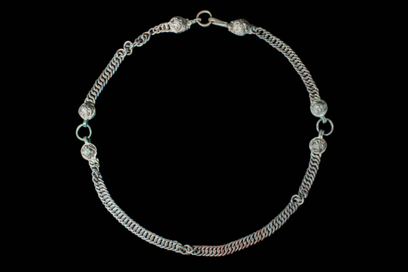 HELLENISTIC BRONZE NECKLACE WITH STYLISED GEOMETRIC SYMBOLS

 Ca. 300 BC A Hel...