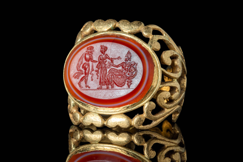 ANCIENT ROMAN CARNELIAN INTAGLIO WITH PARIS, ALEXANDER AND VENUS IN GOLD RING
...