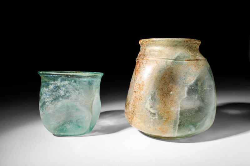 PAIR OF ROMAN GLASS BEAKERS

 Ca. AD 100 - 300 A pair of Roman glass vessels. ...