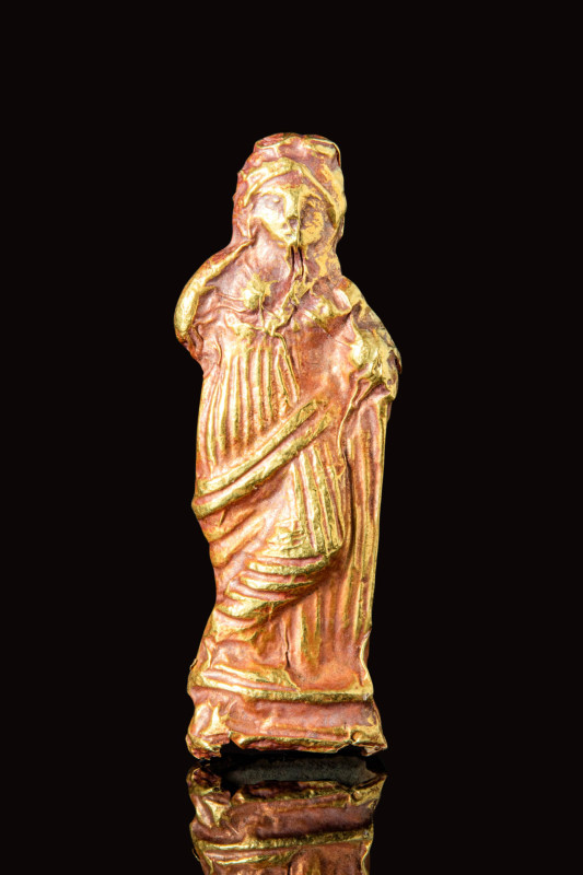 ROMAN GOLD FIGURE OF A GODDESS

 Ca. AD 100 - 200 A Roman gold hollow votive s...