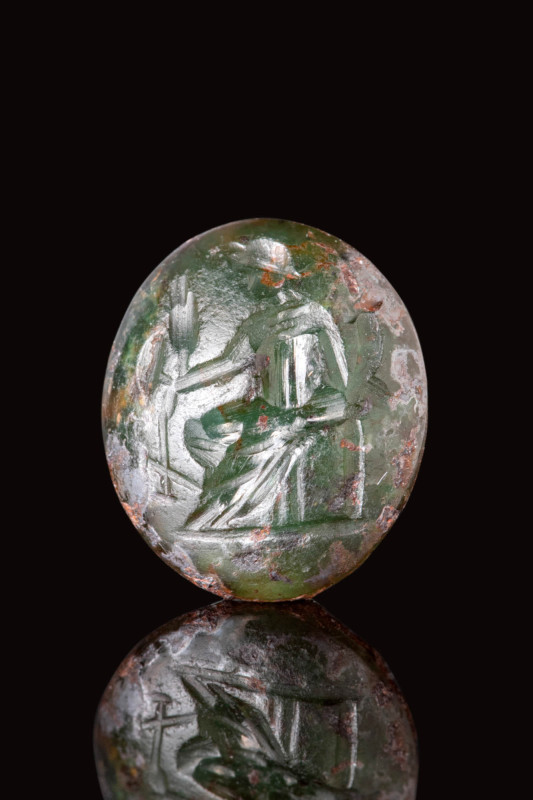 ROMAN GREEN GLASS INTAGLIO DEPICTING A GODDESS ON THRONE

 Ca. AD 100 - 302 A ...