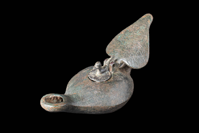 ROMAN BRONZE OIL LAMP WITH DOVE

 Ca. AD 100 - 300 A Roman cast bronze oil lam...