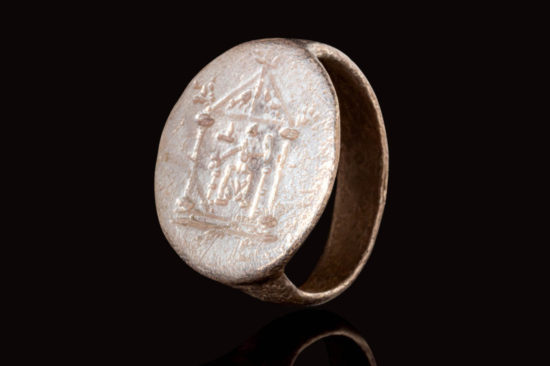 ROMAN SILVER RING DEPICTING A TEMPLE

 Ca. AD 100 - 300 A Roman silver ring wi...