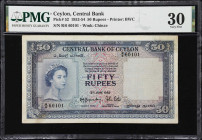 CEYLON. Lot of (2). Central Bank of Ceylon. 50 & 100 Rupees, 3.6.1952. P-52 & 53a. PMG Very Fine 25 & 30.
Two better denominations from Ceylon in nic...