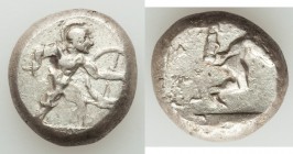PAMPHYLIA. Aspendus. Ca. mid-5th century BC. AR stater (18mm, 10.85 gm). VF, overstruck. Helmeted hoplite advancing right, spear forward in right hand...