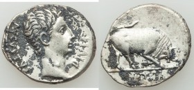 Augustus (27 BC-AD 14). AR denarius (19mm, 3.25 gm, 5h). VF, deposits. Lugdunum, 15-13 BC. AVGVSTVS-DIVI•F, bare head of Augustus right / IMP•X, bull ...