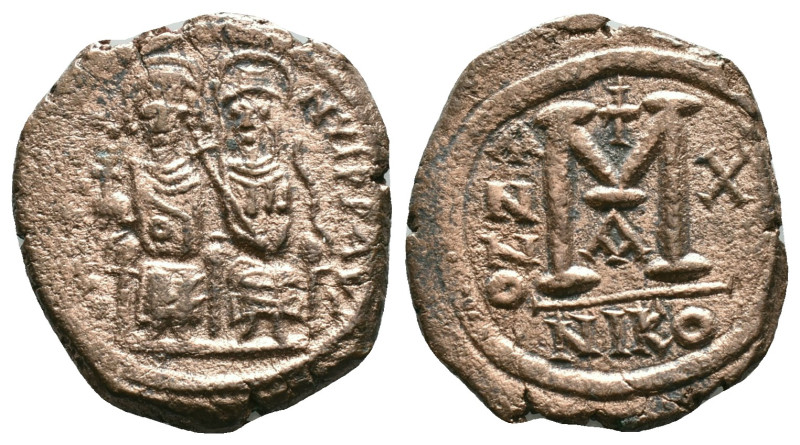 Byzantine Coins, Ae

Justin II, with Sophia 565-578 AD. AE, Follis. Nicomedia....