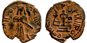 Al-Malik. Follis. Obverse: Imperial figure. Reverse: Modified cross potent set on steps