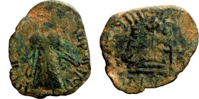 Al-Malik. Follis. Obverse: Imperial figure. Reverse: Modified cross potent set on steps