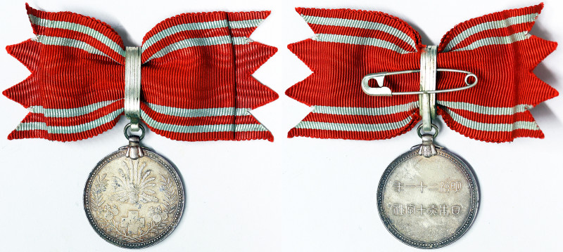 Japan, Hirohito Red Cross Medal for women, n.d., Ø 29 mm ca. White metal.