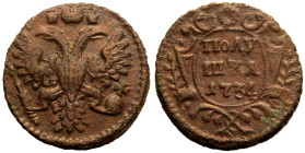 About as struck | RUSSIA. EMPIRE. Anna Ivanovna. 
Copper Polushka, 1734. 
Crowned double-headed eagle holding sceptre and orb / ПОЛУ ШКА, date below...