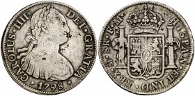1798. Carlos IV. México. FM. 8 reales. (Cal. 692). 26,60 g. Resellos orientales. BC+.