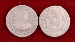 1799 y 1808. Carlos IV. México y Potosí. 1/2 real. 2 monedas, una con perforación reparada. BC/BC+.
