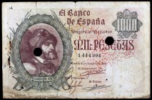1940. 1000 pesetas. 21 de octubre, Carlos I. Falso de época, con dos taladros. Roto. Ex Áureo & Calicó 17/03/2011, nº 2949. (MBC-).