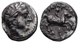 Kings of Macedon, Philip II. 1/5 Tetradrachm, 2.29 g 14.09 mm. 359-336 BC. Amphipolis.
Obv: Head of Apollo right, wearing tainia.
Rev: ΦIΛIΠΠOY. Horse...