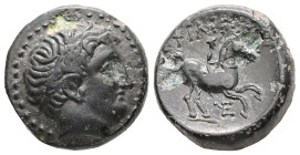 Kings of Macedon, Philip II. Ae, 6.03 g 17.66 mm. 359-336 BC. 
Obv: Diademed head of Apollo right.
Rev: ΦΙΛΙΠΠΟΥ. Youth on horseback right; below, mon...