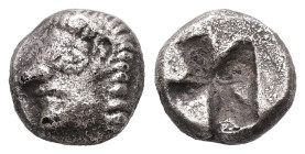 Ionia, Kolophon. AR Obol, 0.91 g. - 8.59 mm. Late 6th century BC.
Obv.: Archaic male head (of Apollo?) left.
Rev.: Quadripartite incuse square.
Ref.: ...