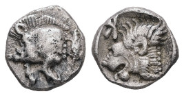 Mysia, Kyzikos. AR, Obol. 0.79 g. - 9.61 mm. Circa 450-400 BC.
Obv.: Forepart of boar left; tunny to right.
Rev.: Head of roaring lion left; retrograd...
