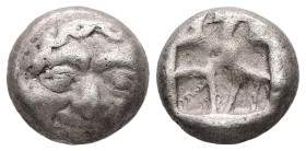 Mysia, Parion. AR, Drachm. 3.17 g. - 12.37 mm. 5th century BC.
Obv.: Facing gorgoneion with protruding tongue.
Rev.: Disorganized linear pattern withi...