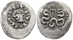 Mysia. Pergamon. AR Cistophoric Tetradrachm, 12.51 g 28.96 mm. Circa 133-67 BC.
Obv: Serpent emerging from cista mystica; all within ivy wreath
Rev: B...