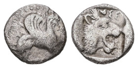 Troas, Assos. AR Obol. 0.54 g 9.14 mm. 5th century BC.
Obv: Griffin seated right.
Rev: AΣΣ, Head of roaring lion right within incuse square.
Ref: Rose...