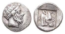 Troas, Lamponeia. AR Hemiobol. 0.43 g 8.26 mm. 4th century BC.
Obv: Bearded head of Dionysos right.
Rev: ΛAM, Head of bull right in incuse square.
...