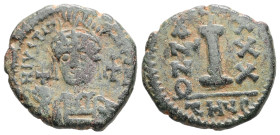 Justinian I, AD 527-565. AE, Decanummium. 4.67 g. 19.96 mm. Theoupolis (Antioch).
Obv: D N IVSTINIANVS P P AV. Helmeted and cuirassed bust facing, hol...