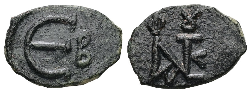 Justin II, AD 565-578. AE, Pentanummium. 1.04 g. 16.03 mm. Constantinople.
Obv: ...