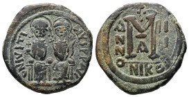 Justin II and Sophia, AD 565-578. AE, Follis. 14.92 g. 31.58 mm. Nicomedia.
Obv: DNIVSTI-NVSPPAVC. Justin II on left and Sophia on right, seated, nim...