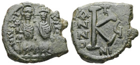 Justin II and Sophia, AD 565-578. AE, Half Follis. 6.80 g. 26.29 mm. Nicomedia.
Obv: DNIVSTI-NVSPPAV. Justin II on left and Sophia on right, seated, n...